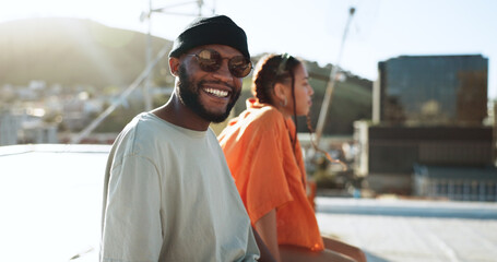 Wall Mural - Black couple, smile and portrait on rooftop in city, outdoors and bonding. Diversity, sunglasses and happy man, woman and relax, love and having fun, enjoying view and spending quality time together.