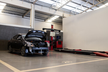 Wall Mural - car repair in garage service station with soft-focus and over light in the background