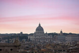 Fototapeta Londyn - Top view from Quirinale Palace of Rome with St Peter's Basilica (San Pietro) in Vatican City, Italy at sunset. It is a famous landmark of Vatican. Nice cityscape of the old Roma
