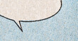 Closeup photo of a vintage comic book page with blue dot printing pattern and empty speech bubble on paper texture background