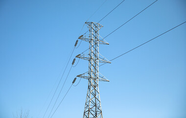 Electrical cables and power station lines for electricity in the blue sky 