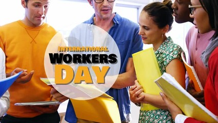 Wall Mural - Animation of international workers day over diverse female and male coworkers talking in office