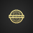© Ind studio - Antioxidants label vector or antioxidants icon logo vector isolated on black background. Antioxidant icon or logo for health product maintain body resistance. Antioxidant seal for multivitamin product