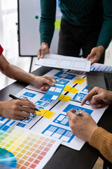 Wall Mural - asian young people working together on mobile application software design project. brainstorming. in