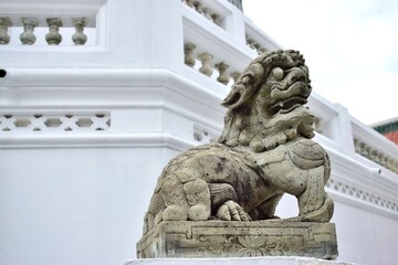 The statue of the ancient lion is the symbol of the guardian who protect the religious place.