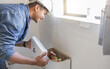 © Lumeez/peopleimages.com - Toilet maintenance, plumber and man fix cistern, home renovation and builder service. Contractor, bathroom tank plumbing and handyman on industrial technician for leak, broken pipe and sewer drainage