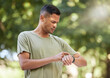 © T Mdlungu/peopleimages.com - Fitness, time and man with watch in nature to check heart, running progress and notification. Sport, exercise and athlete runner reading health, pulse or tracking training on technology in Australia