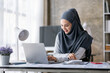 © David - Excited muslim woman sit at desk feel euphoric win online lottery, happy black woman overjoyed get mail at tablet being promoted at work, biracial girl amazed read good news at computer