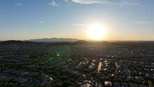 Ultra Wide Aerial View Of Vast Neighborhoods Under The Setting Arizona Sun.