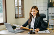 © Nuttapong punna - .Asian lawyer woman working with a laptop and tablet in a law office. Legal and legal service concept.
