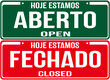 A sign that says in Portuguese  and english language : We are open today  and we are closed  today.