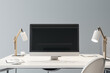 © Who is Danny - Front view on blank black modern computer screen with place for your logo or text on white work table with stylish lamps on light grey wall background. 3D rendering, mockup