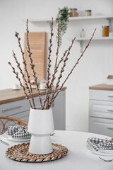 Wall Mural - Vase with willow branches on dining table in kitchen