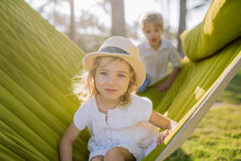 Little Friends Enjoying Holiday In Exotic Country, Lying In Hammock.