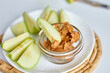 © Viktoriia - Green slices apples with peanut butter on white background, healthy snack, nutrition food, diet
