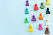 © tomertu - Colorful figures connected over blue background, concept of human resources and collaboration