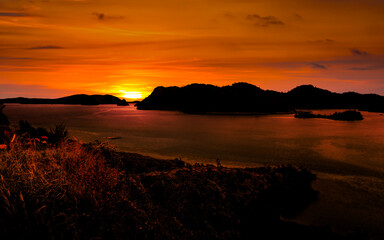 Wall Mural - Golden hour sunset with sea and island