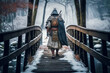 person on bridgeperson walking in a bridge, snowy landscape, samurai walking in winter, AI generative 