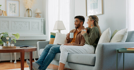 Wall Mural - Relax, coffee and watching tv with couple on sofa together for movie, streaming service or television. Happy, love and tea with man and woman in living room at home for video, film and news lifestyle