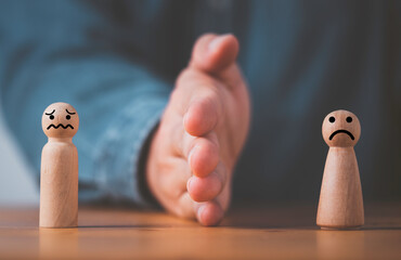 palm hand blocking and divide between man and woman wooden figure for resolving conflict and mediate
