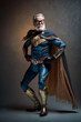 © Giordano Aita - Elderly but agile man, dressed in a super hero costume, ready to do heroic action - AI generative