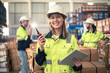 © krumanop - Warehouse Worker in safety suite using digital tablets to check the stock inventory in large warehouses, a Smart warehouse management system