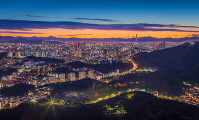 Wall Mural - Seoul City skyline and downtown and skyscraper at night  is The best view and beautiful of South Korea at Namhansanseong mountain.