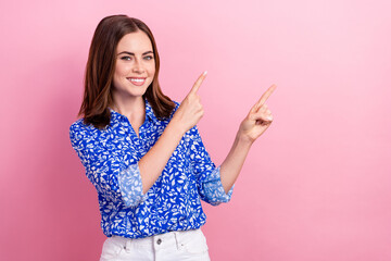 Poster - Photo of gorgeous cheerful lady toothy smile indicate fingers empty space isolated on pink color background