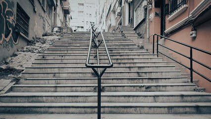 An old stairway stuck between narrow streets