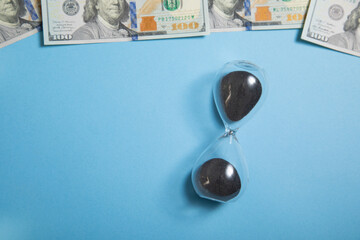 Wall Mural - Hourglass and dollar. Time is money