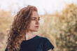 © Todayphoto - Side view of a charming young woman's face. Wavy hair, black T-shirt.