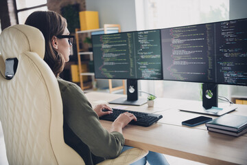 Wall Mural - photo of serious cool lady system admin wear eyeglasses checking framework indoors workplace worksta