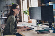 © deagreez - Photo of busy serious lady content manager wear eyeglasses testing secure system indoors workplace workstation