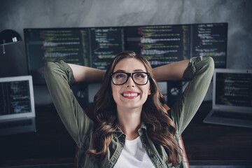 Wall Mural - photo of smiling dreamy lady boss wear eyeglasses hands arms behind head having rest indoors workpla