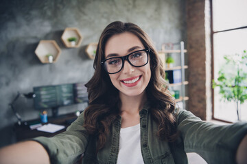 Wall Mural - portrait of positive girl seo expert make selfie recording video toothy smile workplace indoors