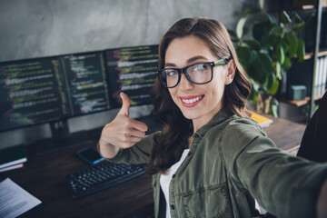 Wall Mural - photo of intelligent cool lady boss wear eyeglasses showing thumb up recording video vlog indoors wo