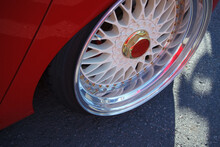 Low Profile Chrome Wheel On Tuner Car. Custom Polished Rims On Sports Car.