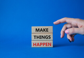 Wall Mural - Make things happen symbol. Concept word Make things happen on wooden blocks. Businessman hand. Beautiful blue background. Business and Make things happen concept. Copy space