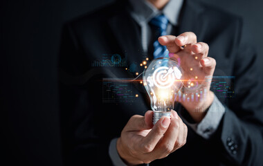 Fototapete - Businessman holding light bulb for business analysis management, Idea and imagination, innovation development leadership, Solution analysis and development, Innovative technology.
