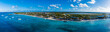 An aerial panorama view over the island of Grand Turk on a bright sunny morning