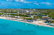 An aerial view over a resort and airport on the island of Grand Turk on a bright sunny morning