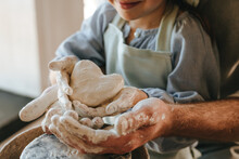 Little Girl Working With Clay On Potter's Wheel