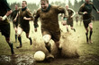 Epic soccer match on a muddy amateur soccer field, generative ai