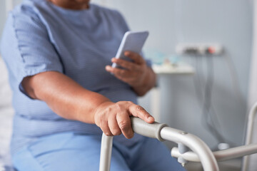 Wall Mural - Close up of senior woman using mobility support in hospital room, copy space