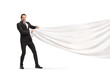 © Ljupco Smokovski - Businessman pulling a white piece of cloth