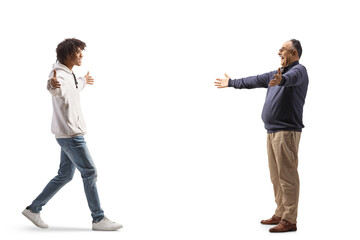 Wall Mural - African american young man meeting a happy mature caucasian man