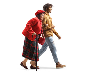 Canvas Print - Young african american man holding a caucasian senior woman under arm and walking