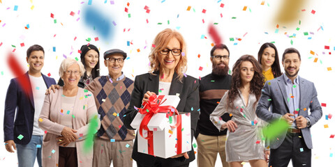 Poster - Woman opening a present box and friends and family standing behind