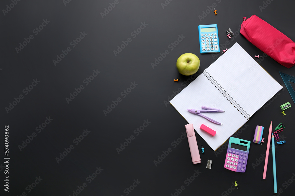 Set of different stationery and blank notebook on dark background. Pi Day celebration