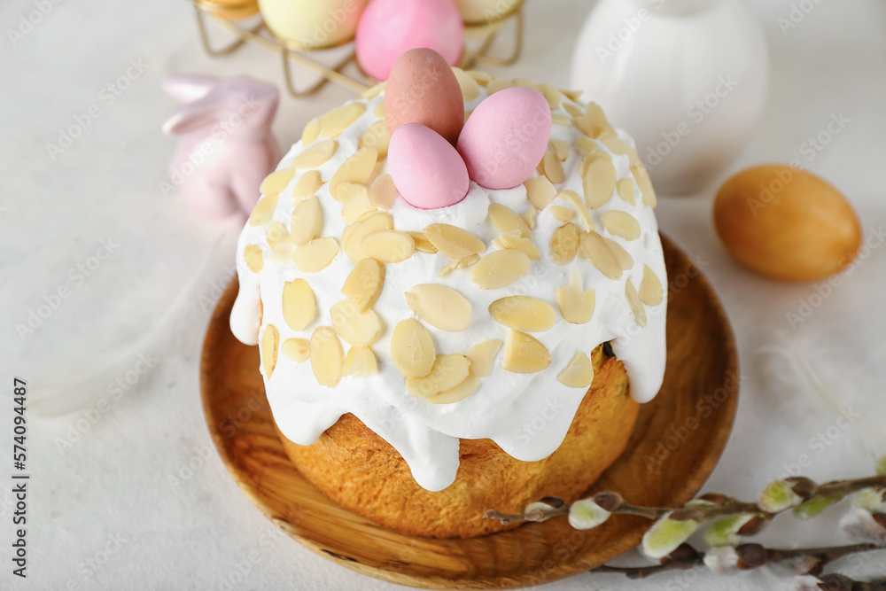 Easter cake with painted eggs on white background